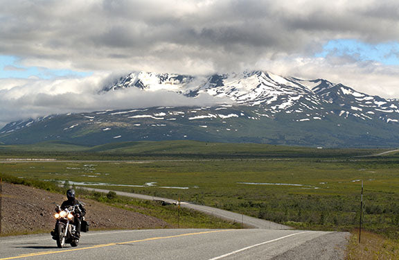 A photo of Alaska's Haines Highway winding through majestic mountains