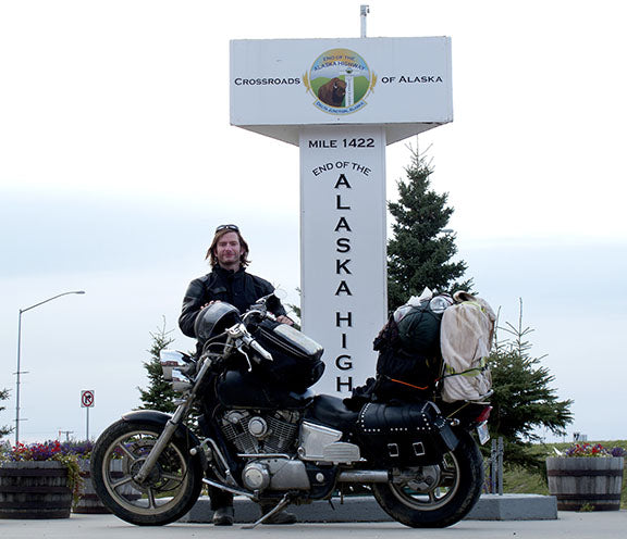 Photographer Geoffrey Kula and his 1995 Honda Shadow VT1100 motorcycle at the end of the ALCAN (a.k.a. the Alaska Highway) in Delta Junction, Alaska