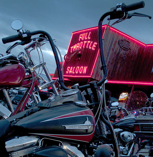 A Harley-Davidson motorcycle waits for its owner to return outside the Full Throttle Saloon in Sturgis, South Dakota