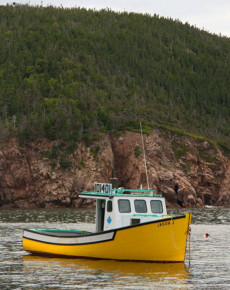 A lone fishing boat floats in the waters bordering Maine and Canada photo