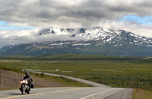A photo of Alaska's Haines Highway winding through majestic mountains