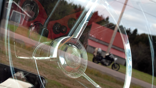 Photographer Geoffrey Kula's 1995 Honda Shadow VT1100 is reflected in the window of a classic car in New Brunswick, Canada 