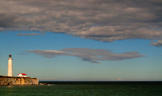 A lighthouse on the Gaspe Peninsula, Quebec, keeps boats safe as they navigate the Gulf of Saint Lawrence.