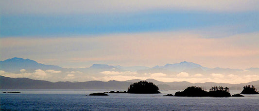 Early morning ferry rides from Port Hardy to Prince Rupert, British Columbia deliver distinct silhouettes of Inland Passage islands against cool blue skies.