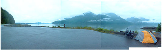 Photographer Geoffrey Kula's tent and 1995 Honda Shadow VT1100 enjoy the makeshift campsite with a view outside of Prince Rupert, British Columbia
