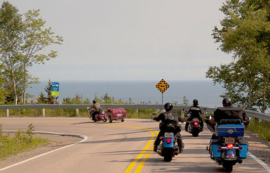 Motorcyclists ride Canada's Cabot Trail by Ingonish, Nova Scotia.