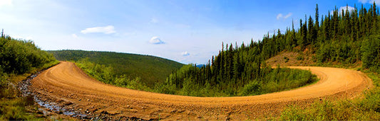The remote Top of the World Highway, which connects Tok, Alaska to Dawson City in the Yukon Territory, is a joyride for motorcycle adventurers and offers spectacular views such as this one.