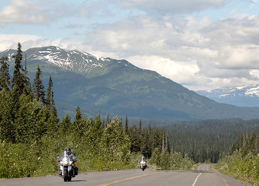 Automobile traffic on the Stewart–Cassiar Highway is rare, motorcycles even moreso. Here, a pair of Harley-Davidsons roar down Route 37 in British Columbia, Canada.