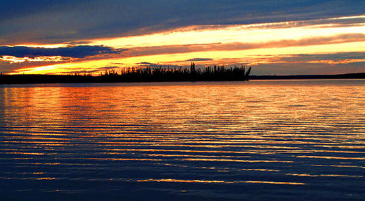 The setting sun illuminates Watson Lake in Canada's Yukon Territory.